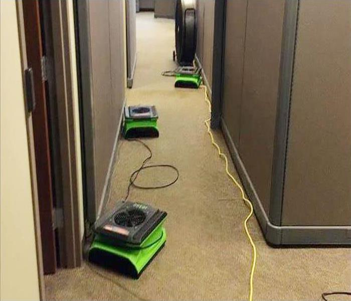 equipment placed in hallway during drying process