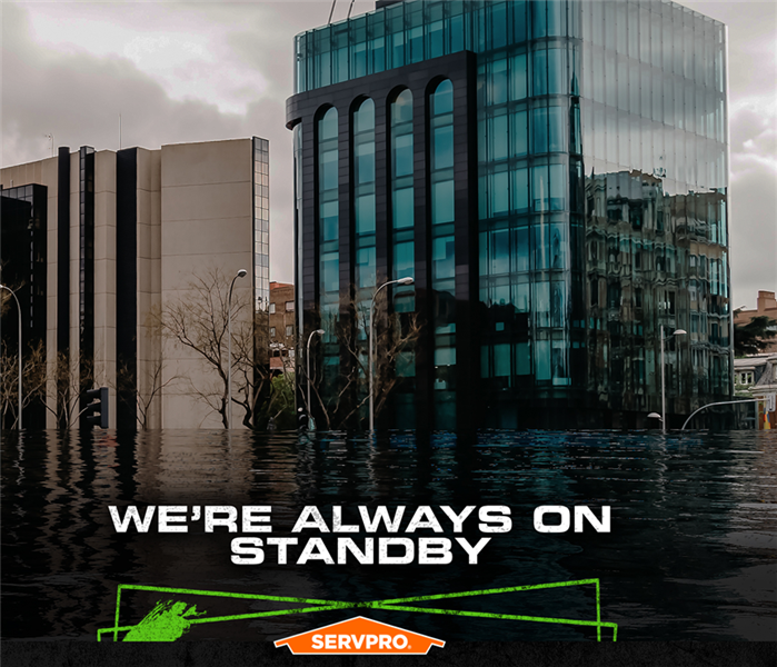 Flooded streets outside large office buildings, with the caption: WE